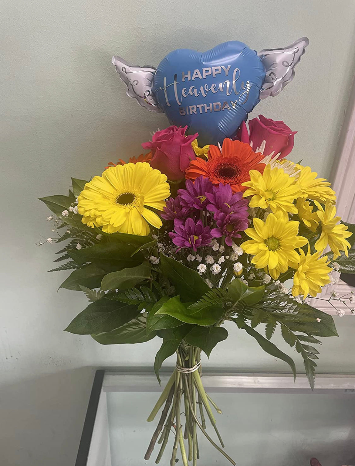 Happy Heavenly Birthday blue balloons on a stick heart shaped with angel wings + bouquet of flowers