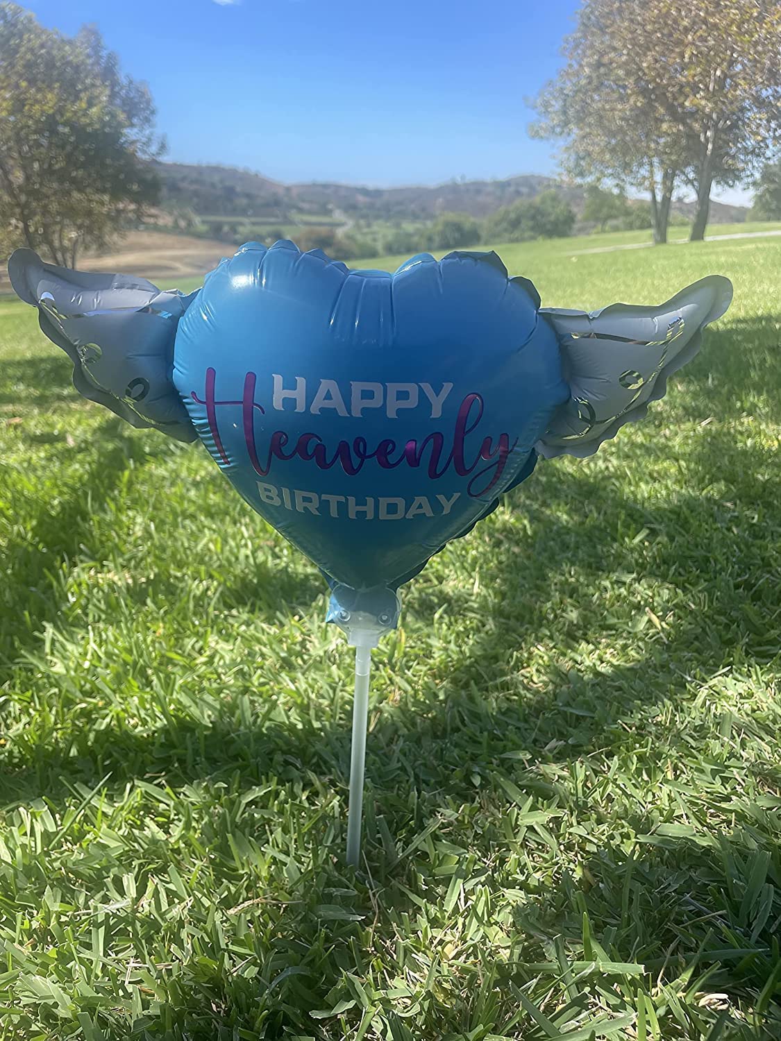 Happy Heavenly Birthday blue/purple balloons on a stick heart shaped with angel wings
